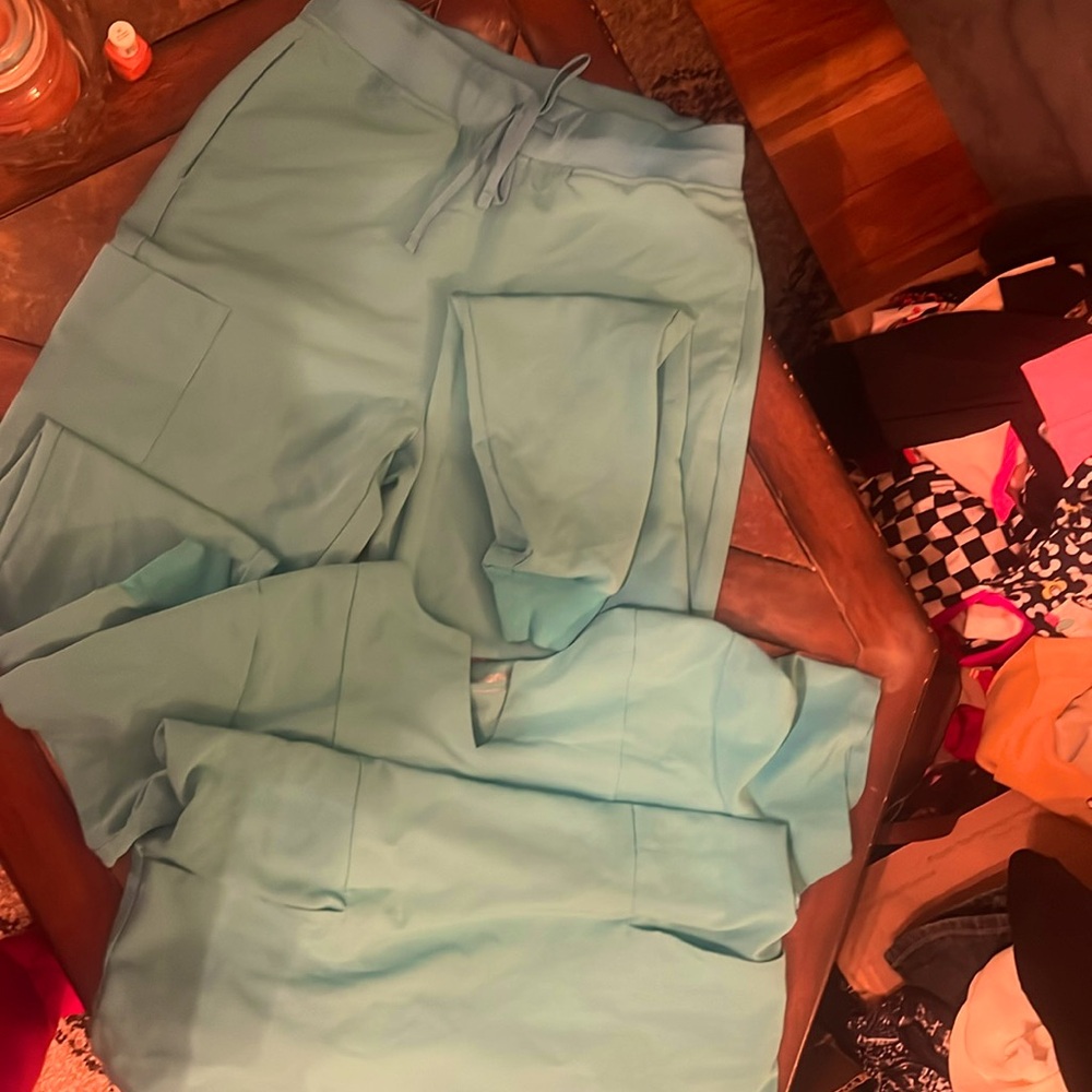 Scrub set, almost a teal color. Darker than photos, pants sm tall, top medium